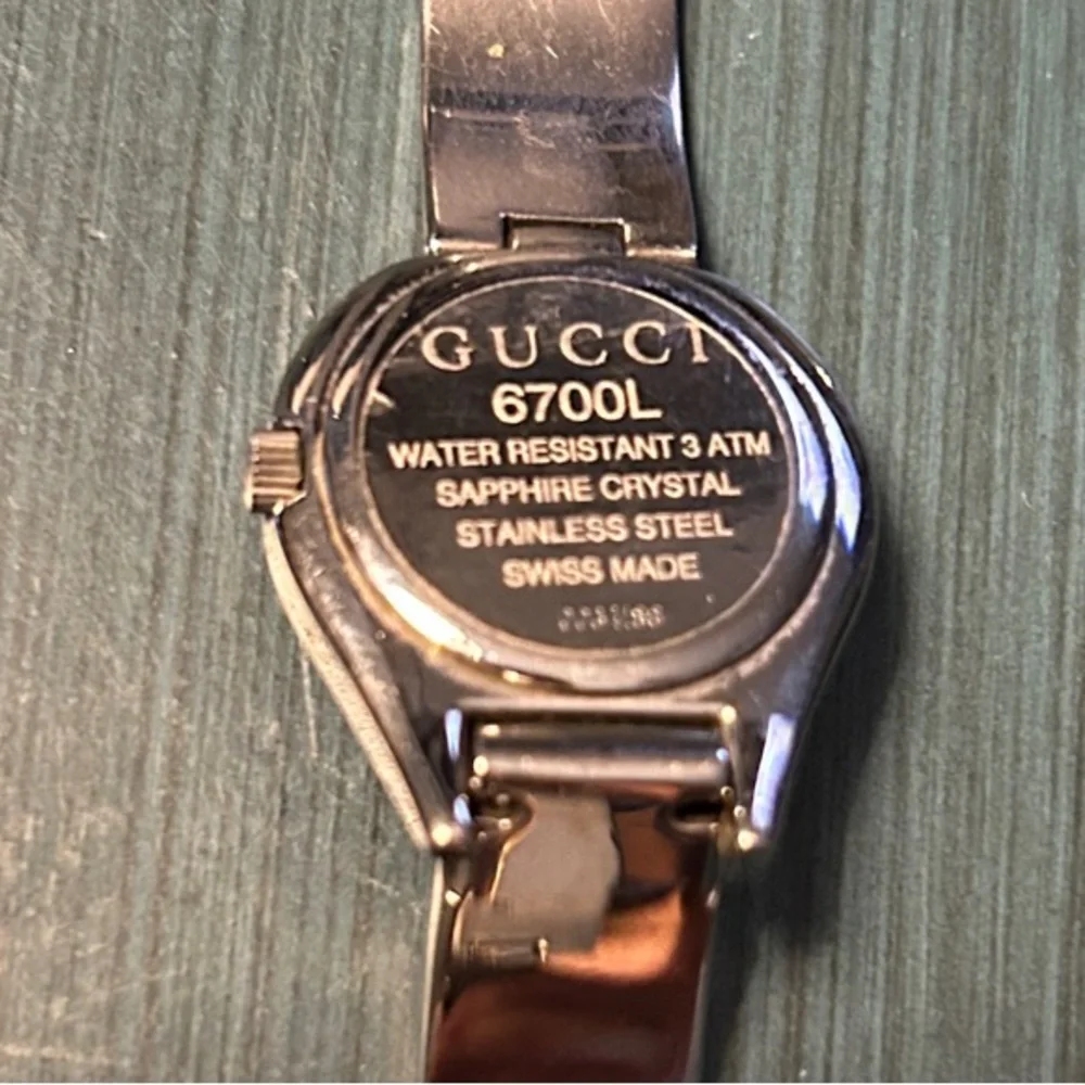 318. Gucci 6700L watch with COA